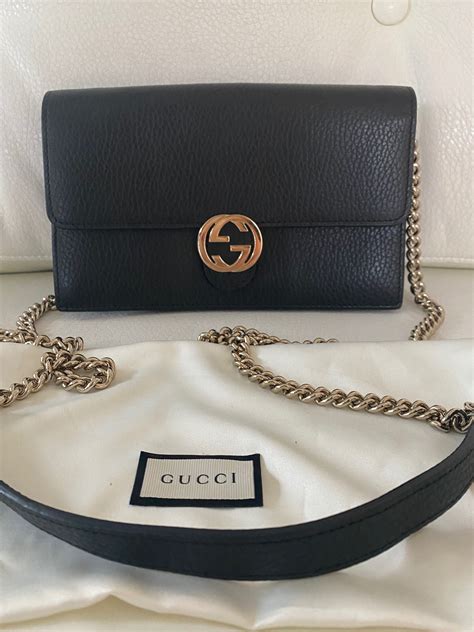 gucci wallet hand clasp|Gucci interlocking wallet on chain.